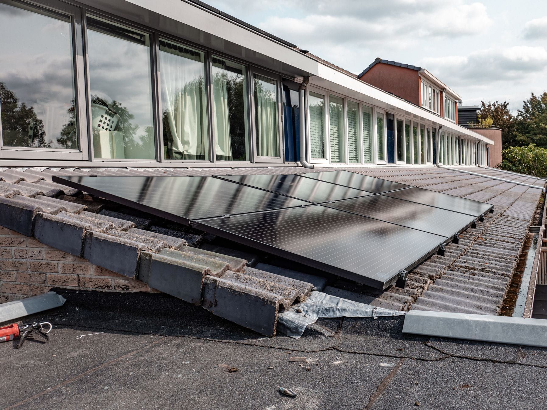 Solar panels covering the roof of a modern house.